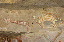 Aboriginal rock art paintings of man and mammal at Main Art Site, Mt Borradaile,  Arnhem Land, Northern Territory, Australia