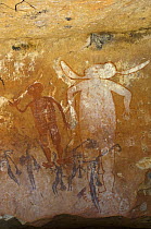 Ancient Wandjina figures painted over a much older panel of Bradshaw rock art, Northern Kimberley region and the Mitchell Plateau, Western Australia