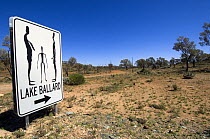 Sign to the Fifty-one carbonised statues, rendered from full body scans of the citizens of Menzies, now inhabit the dried salt bed of Lake Ballard. The statues were created by Antony Gormley for Perth...