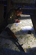 Poacher arrested by Siberian tiger anti-poaching patrol (with secret police for extra protection), 600 miles north of Vladivostok, Primorsky, Russian Far East, October 2005
