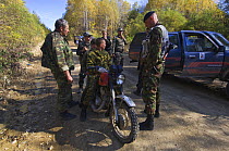Siberian tiger anti-poaching patrol stopping and searching people on forest road, 600 miles north of Vladivostok, Primorksy, Russian Far East, October 2005