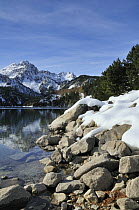 St. Maurici Lake and snowy peaks of Aiguestortes National Park, Pyrenees, Catalonia, Spain. November 2008