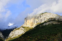Clouds forming over limestone escarpment in the Pyrenees above Revilla, Aragon, Spain.