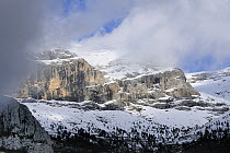 Limestone cliffs, snow and clouds above Revilla, Spanish Pyrenees, Aragon. 2008