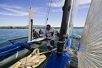 Crew crossing the trampoline aboard Decision 35 yacht "Banque Populaire", Skippered by Pascal Bidegorry, during the Challenge Julius Baer race, Geneva, May 2009.