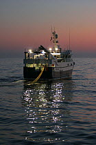 MFV ^Ocean harvest^ shooting the net at dusk. North Sea, September 2008.  Property Released.