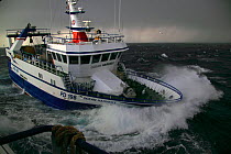 MFV coming alongside partner vessel to start pair trawling operations. North Sea, 2009. Property released.