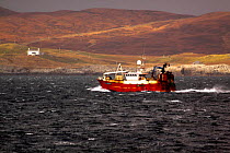 Local Shetland fishing vessel heading to shore for a fish auction in Lerwick. March 2009.