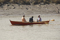 Three men rowing Oselver Faering boat "Hlatr" along the River Avon near Bristol, during the "Bristol Challenge" race, March 21st 2009.