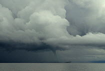 Waterspout and towering cumulus cloud over Lake Malawi, February 2008, Malawi.