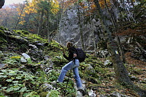Hiker in Valea Crapaturii, Piatra Craiului National Park, Transylvania, Southern Carpathian Mountains, Romania, October 2008