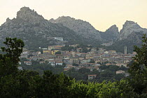 Aggius, a small town with granite hills towering behind, Sardinia, Italy, June 2008