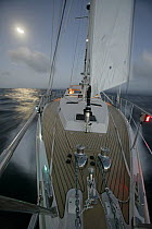 Amel 54 ketch "Hollis" on delivery from Martinique, Caribbean, sailing at night with navigation lights on. Property released, 2006.