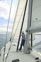 Man on the foredeck of a 53ft Stephens yacht, Florida.  Model and property released.