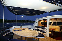 Outside dining area aboard Foutaine Pajot Eleuthra 60 catamaran, Miami, Florida, USA.