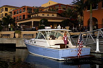 Surf Hunter 33 Jet boat moored at Marco Island, Florida, USA. Model and property released.