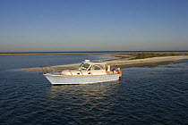 Surf Hunter 33 Jet boat off Marco Island, Florida. Model and property released.