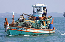 Fishing boat laden with nets, Thailand. February 2006.