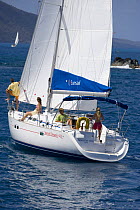 Friends cruising aboard a Sunsail yacht in the British Virgin Islands, March 2006. Model Released.