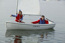 Children sailing dinghy "Liberty".  Model and property released.
