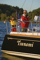 Family sailing Tartan 4300 "Tsunami" on the Severn River, Maryland. Model and property released. October 2007.
