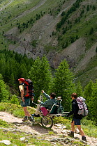 Hiking with handicapped person in the Alps, France, July 2008