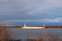 Commercial barge on the River Rhone, Camargue, France, February 2009