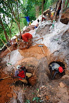 Miners working in an artisanal coltan open-pit mine, Muhanga coltan mines, Rwanda, Africa, March 2009