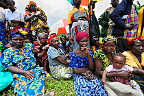 Women waiting for food aid distributed by charities at Kibati village refugee camp, north of Goma, North Kivu, Democratic Republic of Congo, Africa, March 2009
