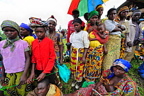 Women waiting for food aid distribution by charities at Kibati village refugee camp, north of Goma, North Kivu, Democratic Republic of Congo, Africa, March 2009