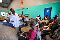 Children singing in the church choir at the Lac Vert refugee camp, west of Goma, North Kivu, Democratic Republic of Congo, Africa, March 2009