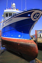 Fishing trawler "Ocean Harvest" being lifted out of the water at Fraserburgh drydock for hull repairs. May 2009. Property released.