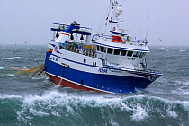 Peterhead registered fishing trawler "Harvester" retrieving her net on the North Sea, June 2009. Property Released.