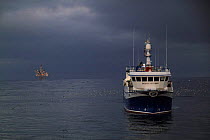 Fishing trawler "Ocean Harvest" near an oil platform on the North Sea, June 2009.