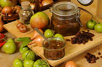 Country kitchen scene of home made Green Tomato Chutney, showing ingedients and traditional kitchen items, UK, October.