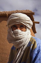 Berber man wearing traditional clothing. Aït Benhaddou Kasbah UNESCO site, Morocco. November 2008.