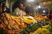 Fresh food being prepared in night souk, Djemaa el-Fna town square, Marrakech, Morocco. November 2008.