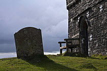 Gravestone and bench at Brentor Church, Dartmoor National Park, Devon, UK.