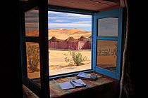 Erg Chebbi desert viewed through an open window, Morocco, March 2009