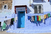 Washing hanging on lines outside house in Chefchaouen / Chaouen, Morocco, March 2009