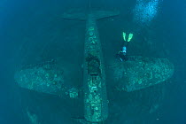 Plane wreck and diver, Kimbe Bay, Papua New Guinea, Indo-pacific