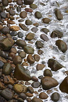 Sea breaking on pebbles, Saltee Islands, County Wexford, Republic of Ireland, May