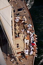 Crew sitting on the rail of W-Class yacht "White Wings" sailing upwind in the Newport Bucket Regatta, July 2009, Rhode Island, USA.