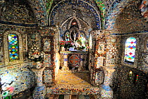 Little chapel in Guernsey, Channel Islands, May 2009. A French priest built it at the beginning of the 20th century with seashells, pebbles and colourful pieces of broken ceramics which he received fr...