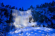 Light on frozen waterfall in Korouoma gorge, Posio, Finland.