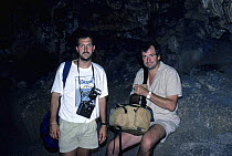 Mark Carwardine and Douglas Adams on location for BBC radio series 'Last chance to see' in Robinson Crusoe's cave, Juan Fernandez Islands, Chile, December 1988