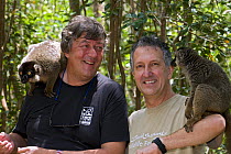 Stephen Fry and Mark Carwardine with Brown lemurs on Lemur Island in Andasibe-Mantadia National Park, eastern Madagascar, while filming for BBC TV series 'Last Chance to See', November 2008