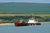 Dredger "Sand Snipe" at work in the Camel estuary near Padstow, Cornwall, UK.