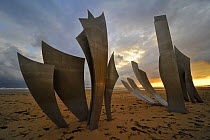The Omaha Beach monument Les Braves, memorial to the D-Day landings, on the beach at Saint-Laurent-sur-Mer at sunset, Normandy, France, September 2008
