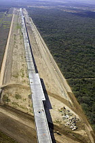 Aerial view of the construction of the Anzalduas International Bridge spanning three miles along a flood plain on the US side of the Mexico / US border, southwest of McAllen, Texas, USA